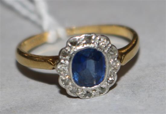 A 1920s 18ct gold, sapphire and diamond cluster ring, size F.